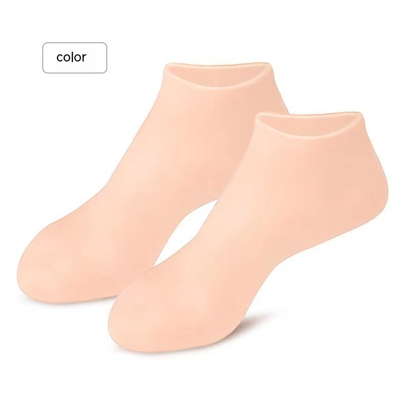 Gel moisturizing silicone socks in nude color for cracked heel care. Reusable indoor foot care socks enhance lotion absorption and soften dry skin.