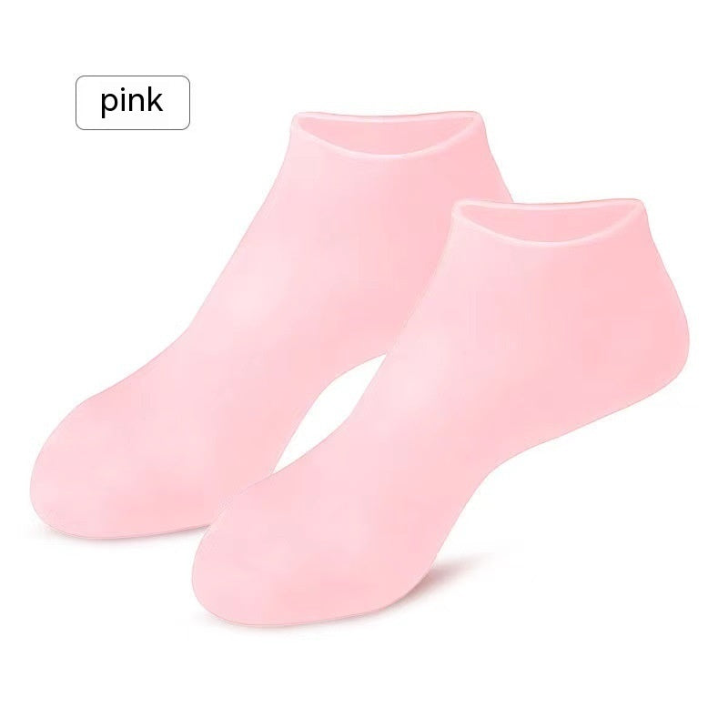 Pink gel moisturizing silicone socks for cracked heel care and hydration. Reusable indoor foot care socks in beauty and personal care category.