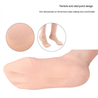 Gel socks with anti-skid design for moisturizing and healing cracked heels. Reusable silicone foot care socks ideal for indoor use and enhanced comfort.